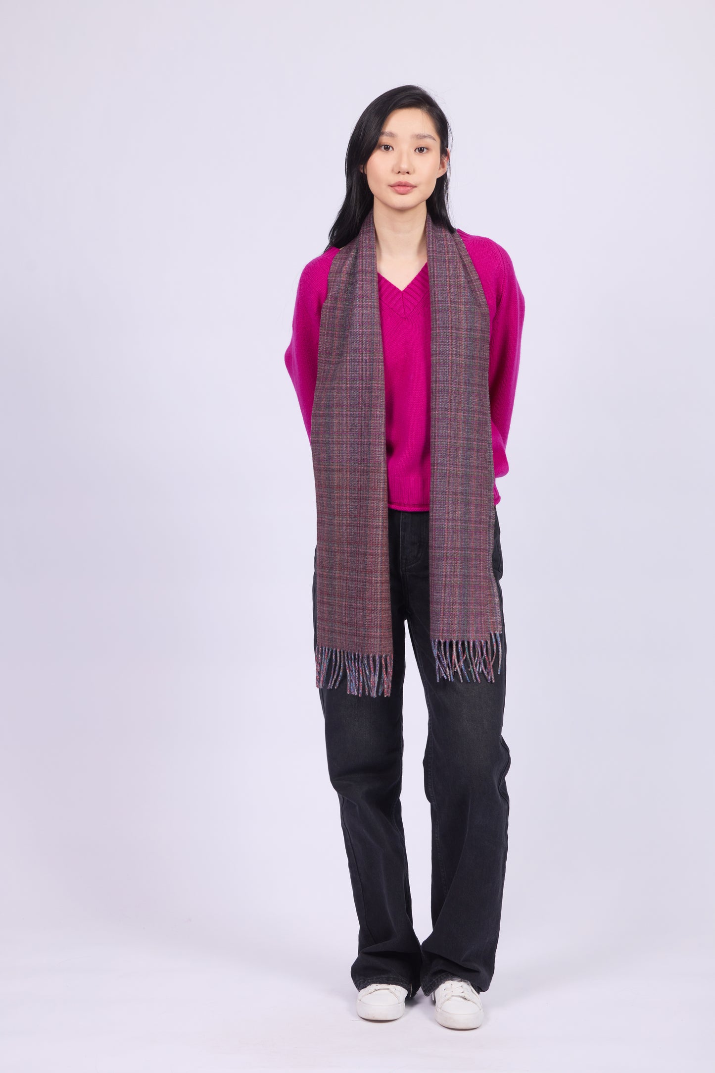 This scarf is a unisex 100% cashmere woven scarf, featuring a classic plaid pattern with a mix of pink, purple, and gray tones.