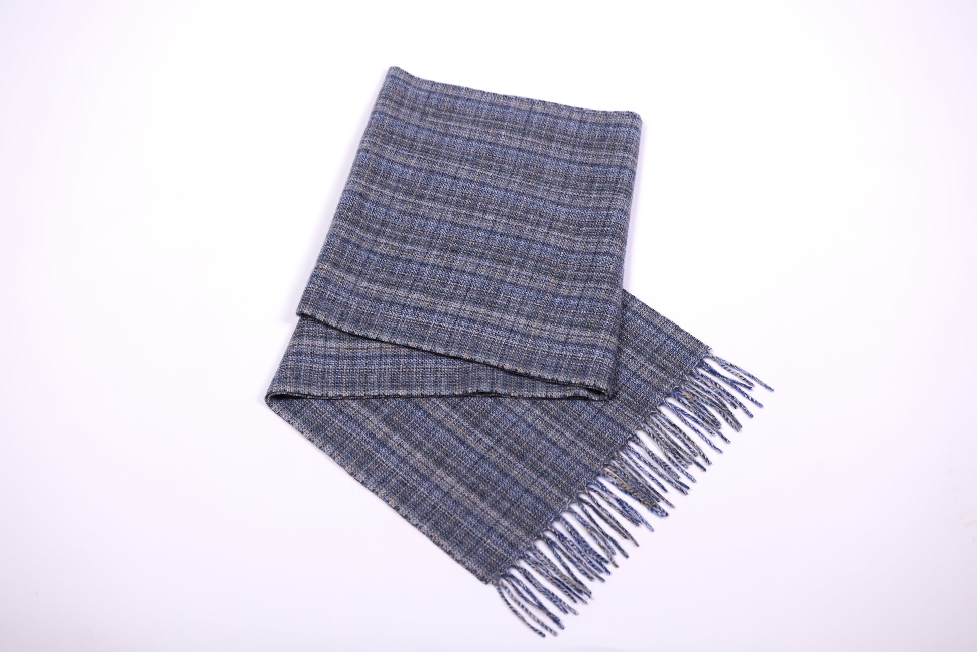 This scarf is a unisex 100% cashmere woven scarf, featuring a classic plaid pattern with a mix of pink, purple, and gray tones. 