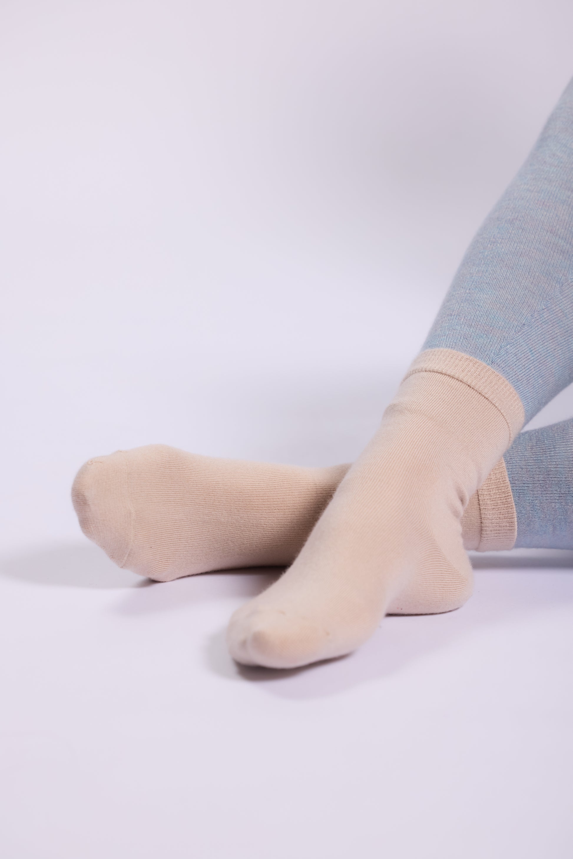 These are soft and luxurious socks made from a silk and cashmere blend. The fabric provides a smooth, lightweight feel with a natural sheen from the silk, complemented by the warmth and softness of cashmere.